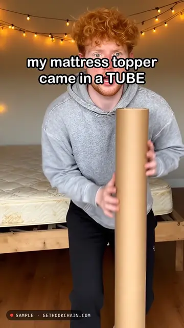Unboxing a mattress topper that comes in a tube